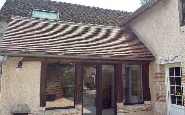 Maison avec toiture en tuiles rénovée à Maslives